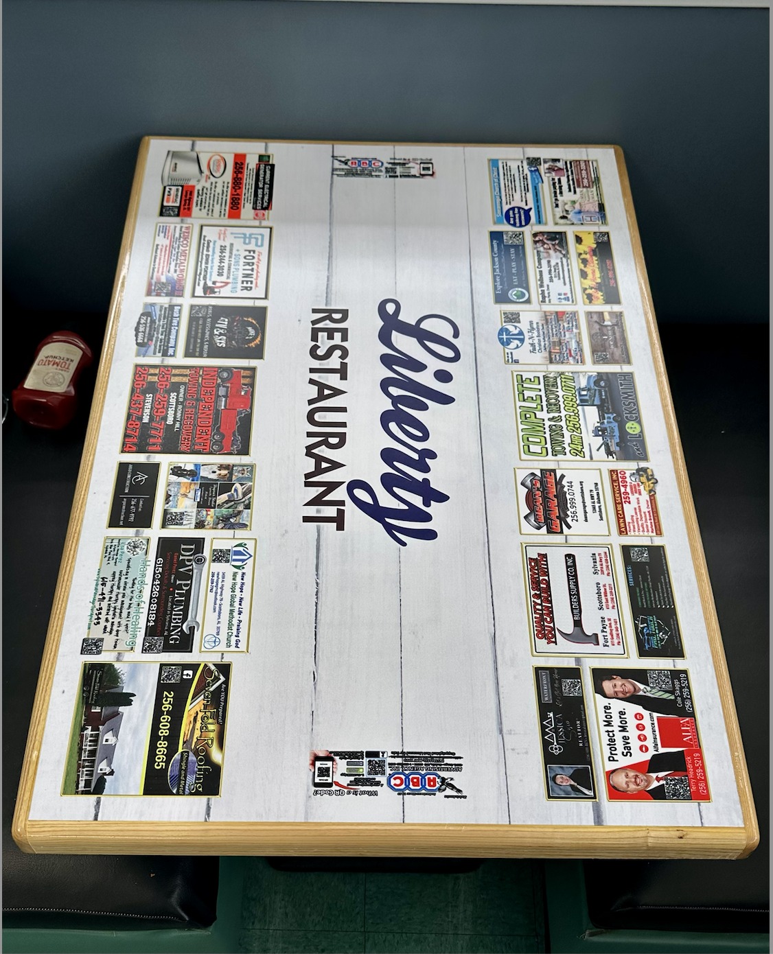 Liberty Restaurant tabletop with business ads