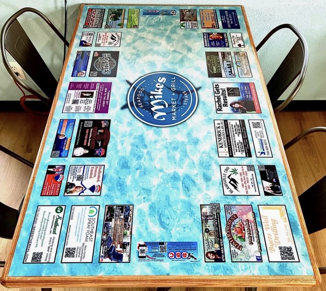 Mike's Market Grill tabletop with local business ads